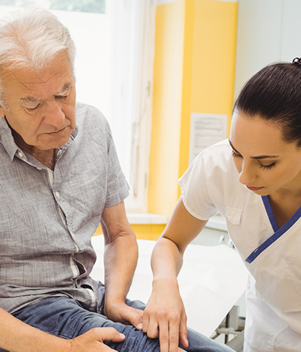 Doctor examining an elderly patient